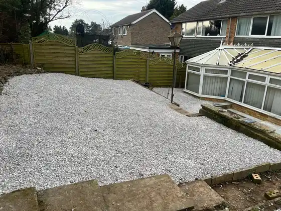 White gravel installation creating a low-maintenance garden area with excellent drainage and visual appeal.